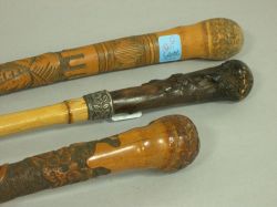 Two Carved Bamboo Walking Sticks and a Root and Sterling Mounted Bamboo Walking Stick. 